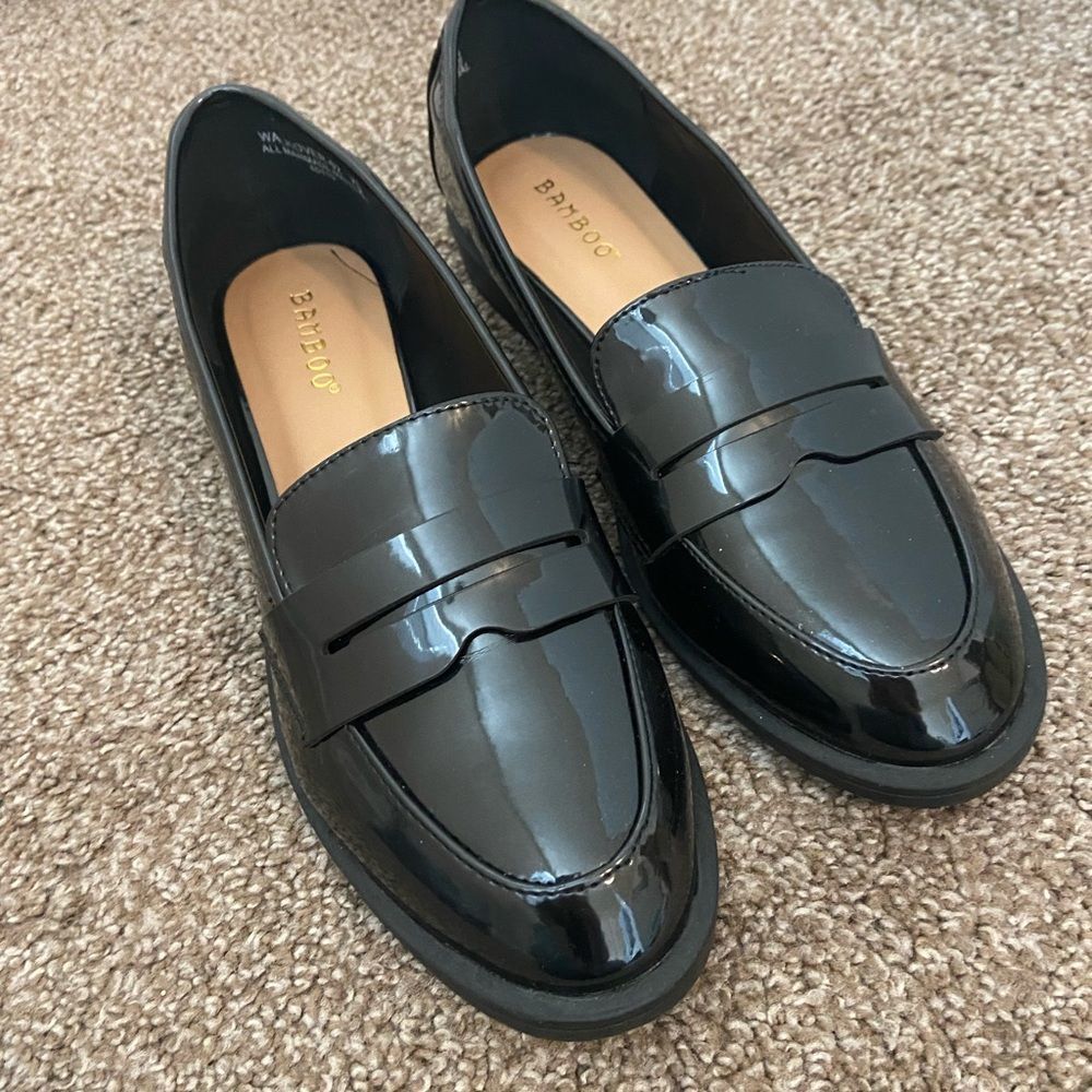 Patent black loafers.